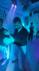 Evening social gathering at disco-lit club in Chaikovsky, Russia