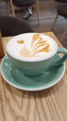 Elaborate latte art in powder at a Bryansk café