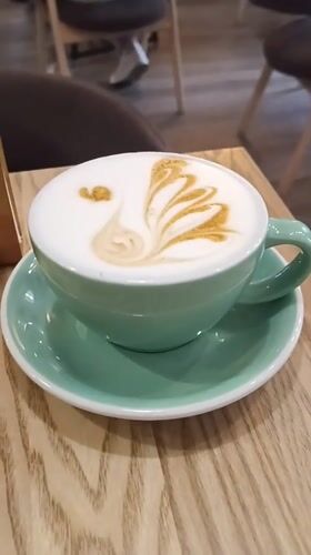 Elaborate latte art in powder at a Bryansk café