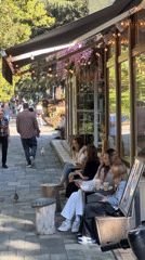 Sunny afternoon cafe life captured across Sochi's outdoor spaces