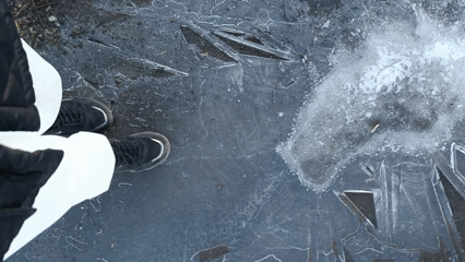 Person walks across cracked ice in early morning hours