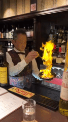 Osaka scenes: flaming cocktail preparation and plush toy browsing