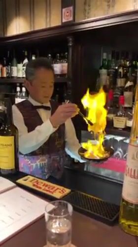Osaka scenes: flaming cocktail preparation and plush toy browsing