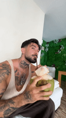 Couple shares coconut drinks in Kathu Thailand indoor setting