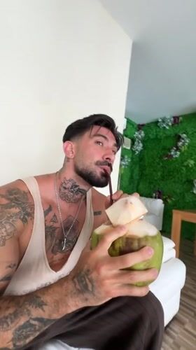Couple shares coconut drinks in Kathu Thailand indoor setting