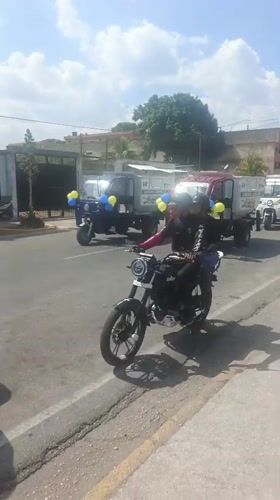 Decorated municipal vehicle procession travels through Tinaquillo, Venezuela