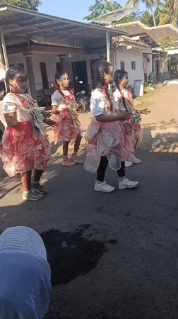 Costumed street parade and dancing in Kedung Dowo, Indonesia
