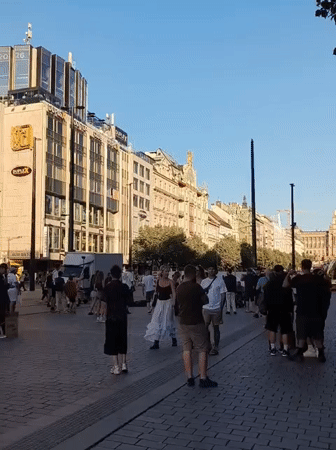 Afternoon foot traffic in a Prague public square