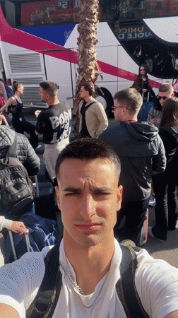 Tourist takes selfie amid crowds in Lloret De Mar