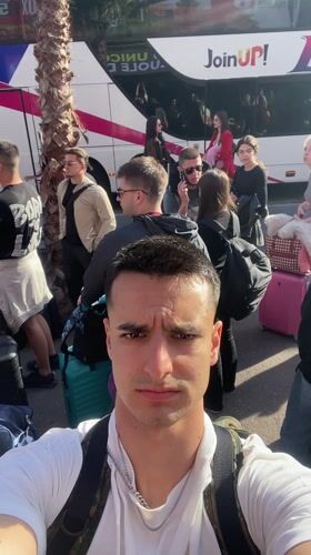 Tourist takes selfie amid crowds in Lloret De Mar