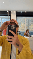 Shopper tries on Von Dutch caps, takes selfies in London store