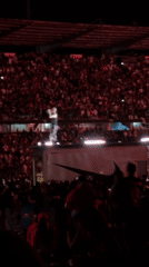 Nighttime stadium concert features performer on Nike-branded truck in Medellín