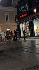 Street violinist performs for evening pedestrians in Belgrade