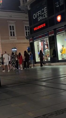 Street violinist performs for evening pedestrians in Belgrade