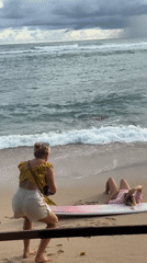 Women photographing on Ahangama beach, Sri Lanka