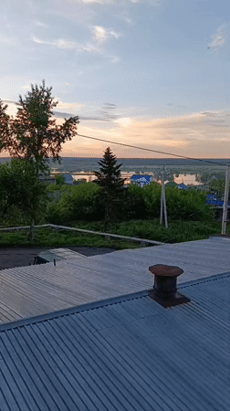 Sunset view captured from rusty rooftop in Tara, Russia