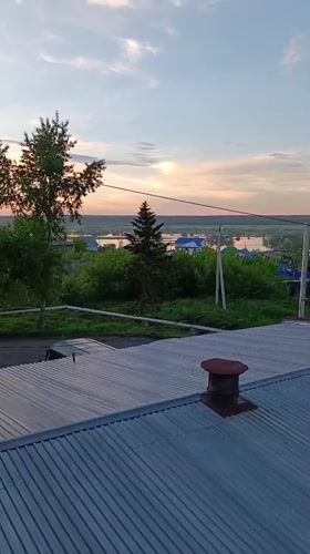 Sunset view captured from rusty rooftop in Tara, Russia