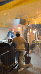 Evening street life and dining captured in Catania, Italy