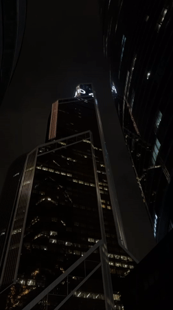 Night view of illuminated skyscrapers captured in Khimki