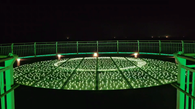 Oryukdo Skywalk glows with green lights in Busan night