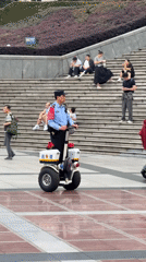 Morning recreation and police presence at Chongqing cultural plaza