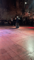 Couple dances on wooden floor in Buenos Aires venue