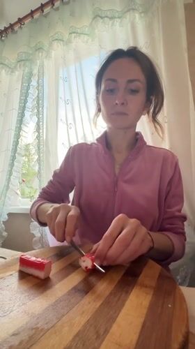 Woman prepares crab sticks in Kryvyi Rih kitchen