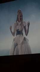 Televised music performance with blonde artist captured by viewers