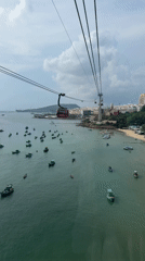 Cable car riders document aerial views of Phú Quốc coastline