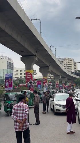 Morning street life documented around Dhaka metro rail system