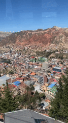 Cable car passenger films aerial view of La Paz