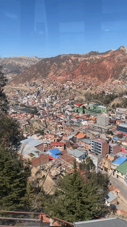 Cable car passenger films aerial view of La Paz