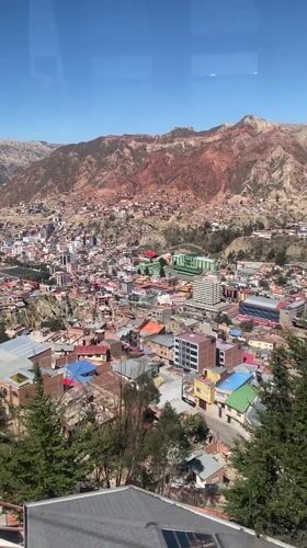 Cable car passenger films aerial view of La Paz