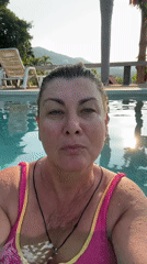 Woman films pool selfie at Thai resort