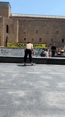 Young people skateboard and cycle in Barcelona plaza