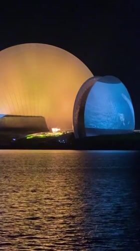 Xiangzhou Grand Theater domes illuminate waterfront at night
