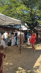 Live sax and garden tables at a sunny Hem wedding reception