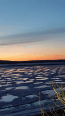 Sunset over frozen Kama River captured in Chaikovsky, Russia