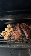 Outdoor barbecue cooking documented in Russian forest setting
