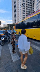 Busy beach morning in Nha Trang, streets and shoreline both packed