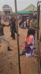 Religious gathering with robed participants documented in Jos, Nigeria
