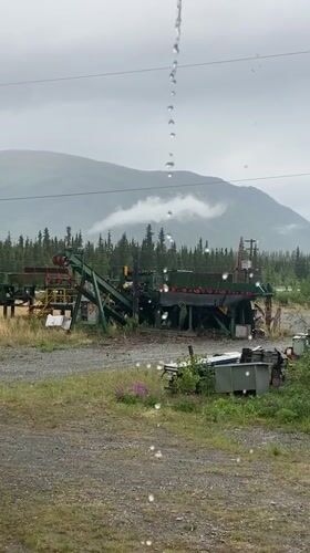 Rainy day at a rural Haines Junction homestead in summer