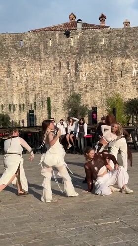 Group dance performance at Budva's old fortress courtyard