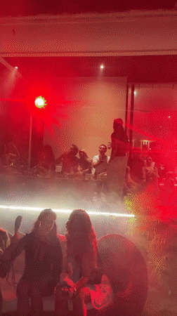 Red-lit outdoor night event at a North Kuta venue