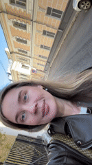 Woman documents personal moments across Moscow in morning selfie session