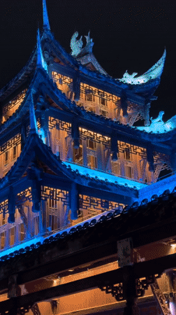 Illuminated traditional Chinese bridges and buildings documented in Qianjiang