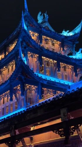 Illuminated traditional Chinese bridges and buildings documented in Qianjiang