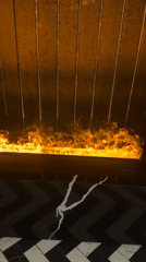 Woman filmed with drink near fireplace in Riga home