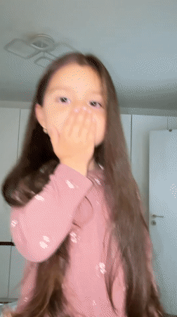 Girl records indoor moments with hair product in Sandanski