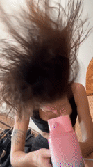 Morning routines: hair styling and cat watching in North Kuta